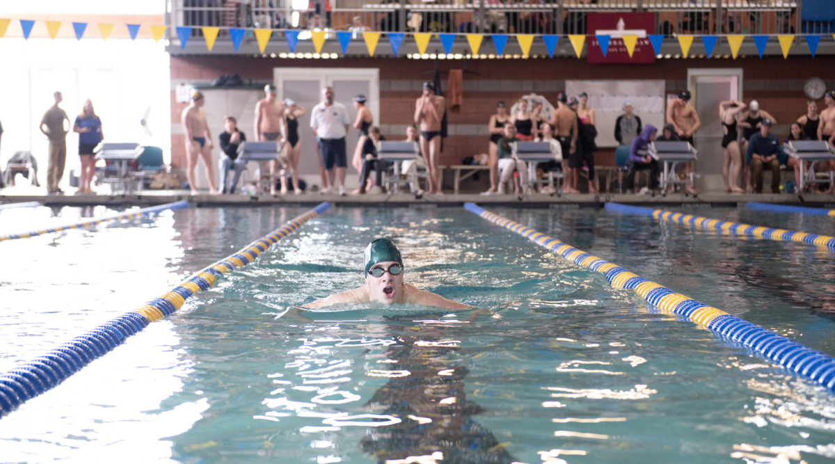 1.31.25 Sophomore Caleb Kay swimming breaststroke during the 200 IM at Butte. 